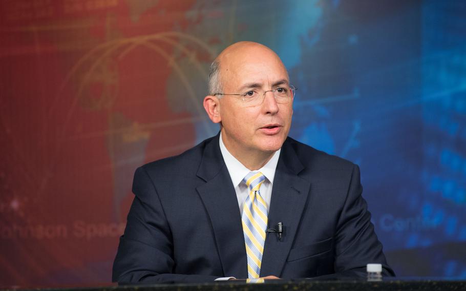 Michael Suffredini, International Space Station program manager, responds to a question from a reporter during a NASA/Roscosmos press conference at NASA’s Johnson Space Center in 2012.