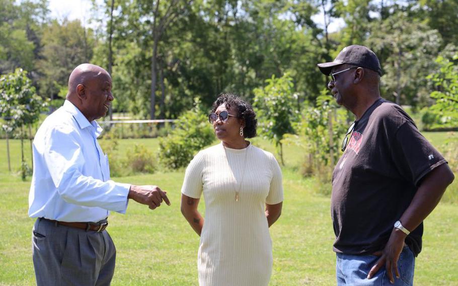 John Atkins discusses plans for a military monument for people of color with veterans Corliss Dennis and Alonzo Senior.