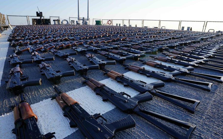 A cache of AK-47s lays on the deck of a ship in an undated file photo shared by U.S. Central Command. The U.S. government transferred the weapons to the Ukrainian armed forces after seizing them from the Islamic Revolutionary Guard Corps, which intended them to arm the Houthis in Yemen.