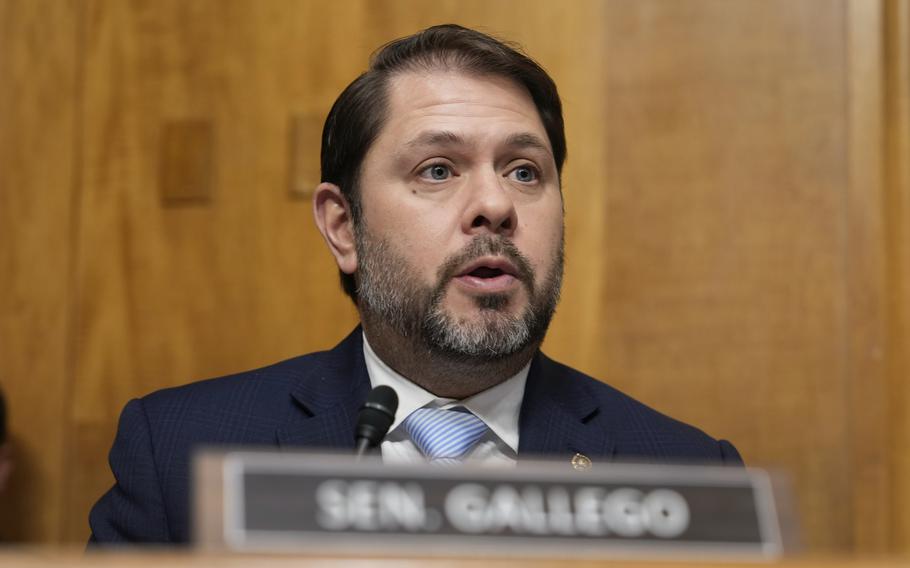 Gallego seated and speaking into a microphone.