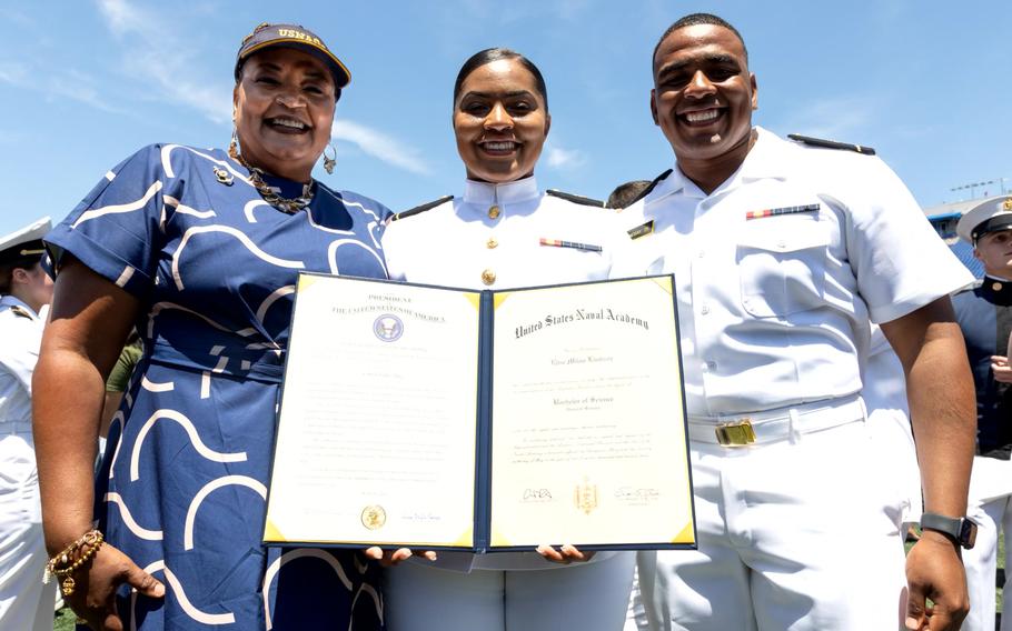 Retired Navy Capt. Timika Lindsay, left, and her daughter, Ensign Elise Lindsay, celebrate at the Naval Academy last month, along with her son, Midshipman Eric Lindsay, who’s set to graduate in 2025. 
