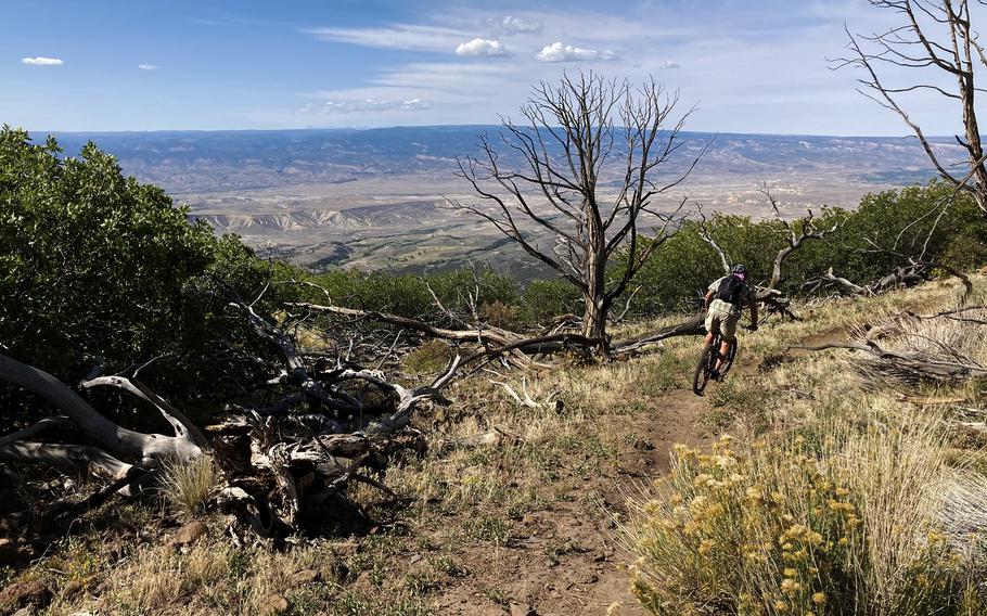 The author’s friend Kurt Casey leans into a corner on the Palisade Plunge trail. 