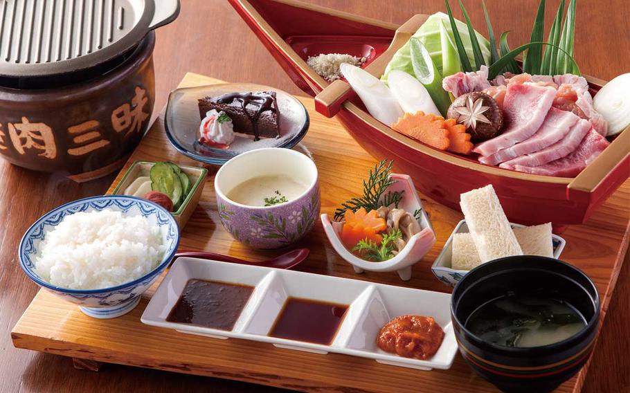 The yakiniku zanmai from Tokiwa-so in Miyakonojo, Japan, includes beef, pork and chicken served with mushrooms on a boat-shaped platter.