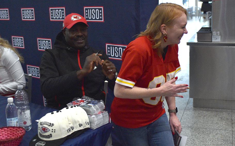 Former Kansas City Chiefs running back Christian Okoye signs Danielle Ward's jersey Nov. 2, 2023, at Ramstein Air Base, Germany. Ward said Okoye was her grandmother's favorite player.