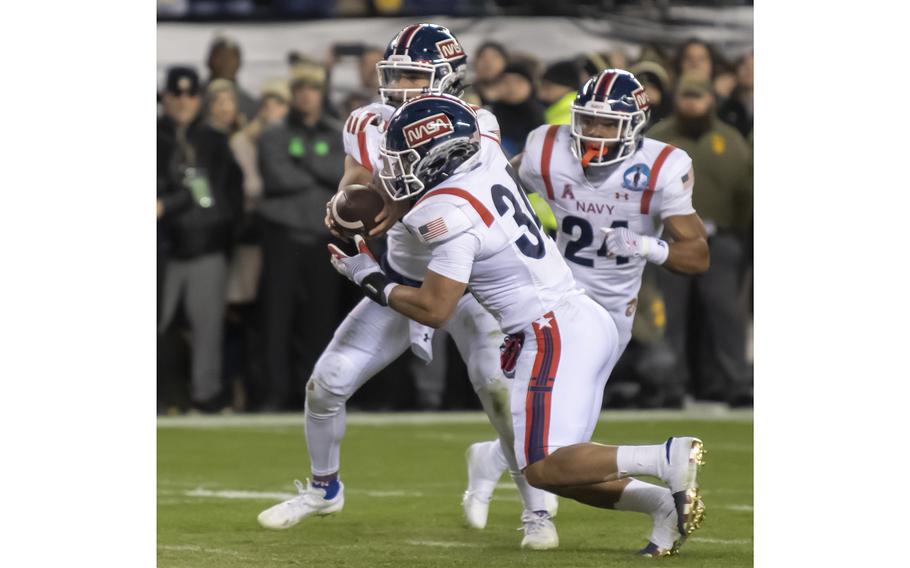 Anton Hall (34) takes the handoff from quarterback Xavier Arline in the second overtime of the Army-Navy game played at Philadelphia’s Lincoln Financial Field on Dec. 10, 2022. Hall reached the 1 yard line when the ball was punched loose. Army recovered and went on to win the game.