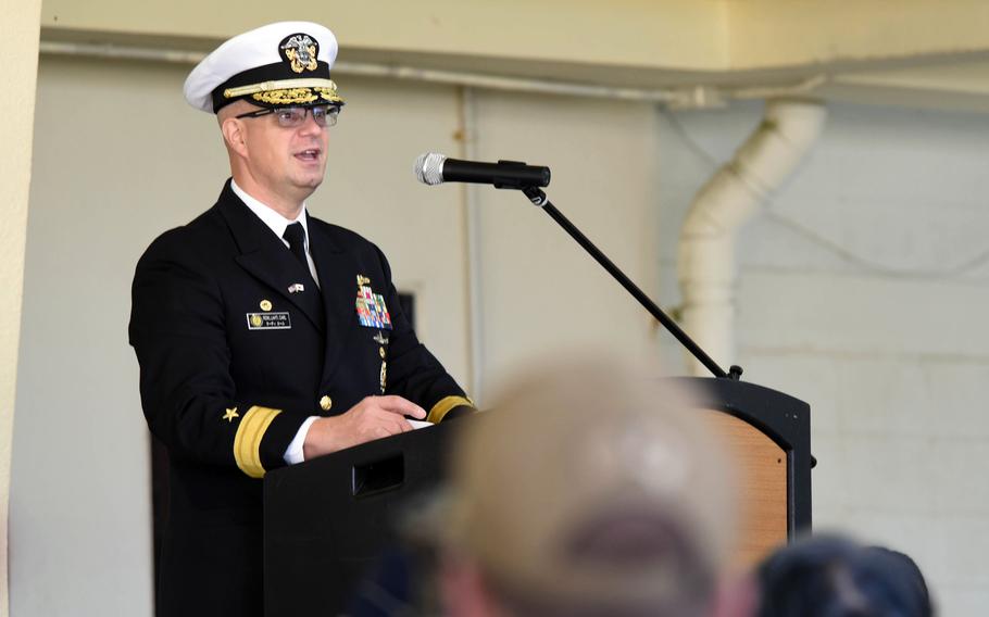 Rear Adm. Carl Lahti, commander of Navy Region Japan, speaks during a change-of-command ceremony for Fleet Activities Okinawa at White Beach Naval Facility, Thursday, Dec 16, 2021.