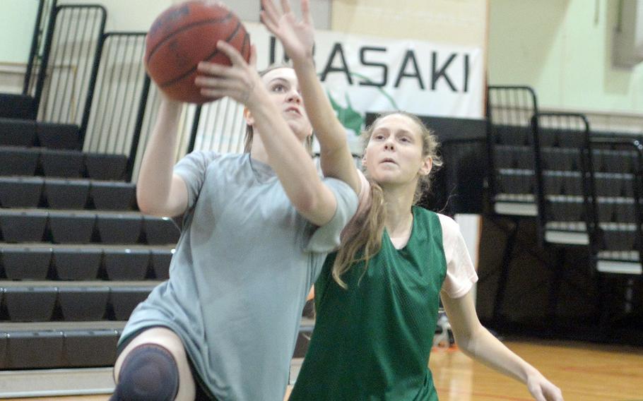 Juniors Moira Easton and Lillian Law and Kubasaki's girls basketball team hope to improve on the three defeats they suffered last season against Kadena.