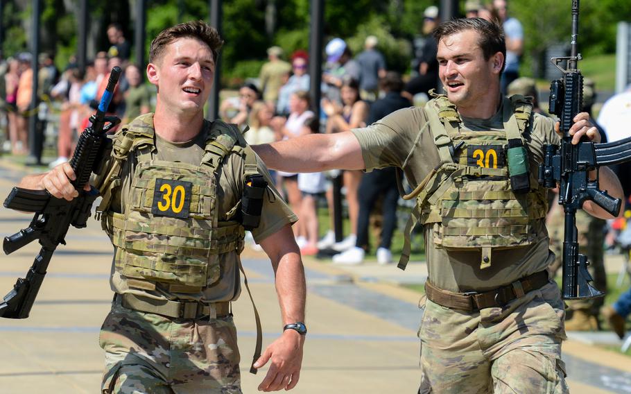 
Army 1st Lt. Nicholas Cefalu and 1st Lt. Jacob Bohnemann, of the 173rd Airborne Brigade, cross the finish line at the 2024 Best Ranger Competition at Fort Moore, Ga. on Sunday, April 14, 2024.