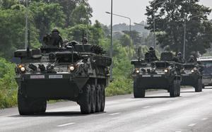 Royal Thai Army soldiers are pictured on armoured vehicles on a road in Chachoengsao province on July 24, 2025. Thailand launched air strikes on Cambodian military targets on July 24 as Cambodia fired rockets and artillery, killing at least 11 civilians, in a dramatic escalation of a long-running border row between the two neighbors. (Lillian Suwanrumpha/AFP/Getty Images/TNS)