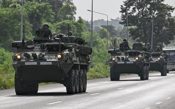 Royal Thai Army soldiers are pictured on armoured vehicles on a road in Chachoengsao province on July 24, 2025. Thailand launched air strikes on Cambodian military targets on July 24 as Cambodia fired rockets and artillery, killing at least 11 civilians, in a dramatic escalation of a long-running border row between the two neighbors. (Lillian Suwanrumpha/AFP/Getty Images/TNS)