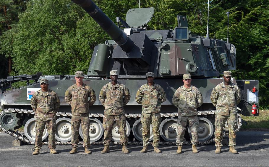 U.S. Army soldiers stand in front of a M109A5 self-propelled howitzer on July 20, 2022, at Grafenwoehr Training Area, Germany. The soldiers were part of the multinational Dynamic Front exercise. 