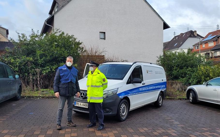 Police stand by at a public information point in Ulmet, Germany, Jan. 31, 2022. They were on site during a search for two suspects involved in the shooting and death of two police officers near Kusel. The suspects are in custody.