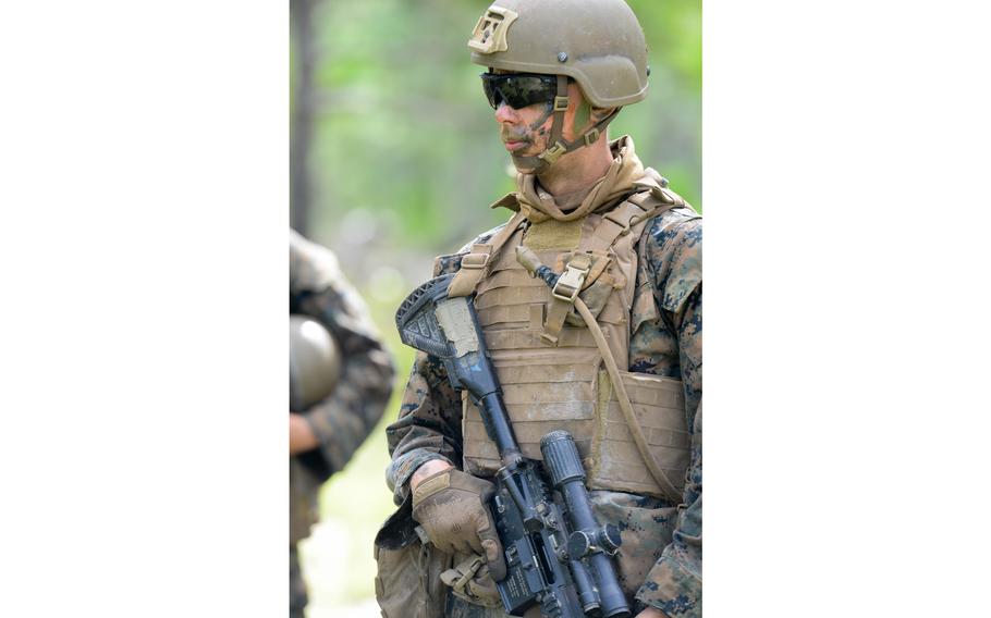 A Marine infantry student at Camp Lejeune, N.C., prepares to practice setting up an ambush in a live-fire training event Aug. 27, 2021, during their 12th week of initial infantry training as part of a pilot program meant to drastically change the way the Corps trains its infantrymen. The pilot program expands infantry training from nine to 14 weeks and places Marines in 14-person squads under a single instructor.