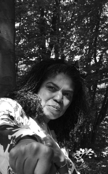 Chrissy Yates reenacts Thomas Hoepker’s famous 1966 photo of Muhammad Ali punching at the camera during a May visit to the Ernst Leitz Museum in Wetzlar, Germany.