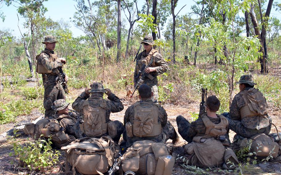U.S. Marines take a breather during Exercise Predator’s Run at Mount Bundey Training Area in Australia's Northern Territory, Wednesday, Aug. 24, 2022.