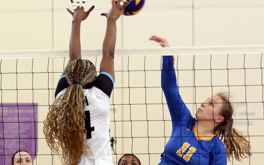 Yokota's Anais Pinard spikes against Osan's Tatiana Lunn during Tuesday's pool-play match in the Far East Division II volleyball tournament. The Panthers won in three sets.