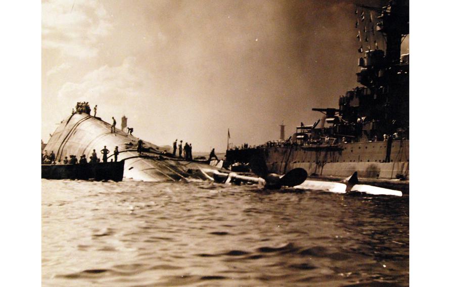The capsized USS Oklahoma and the USS Maryland are shown after the Dec. 7, 1941, attack. 