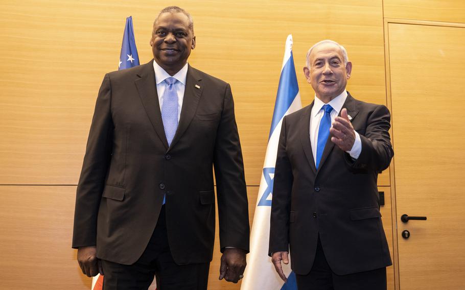 Defense Secretary Lloyd Austin meets with Israeli Prime Minister Benjamin Netanyahu in Tel Aviv, Israel, on March 9, 2023. They will meet again Friday, Oct. 13, 2023, to discuss military plans in response to a recent attack by Hamas militants.