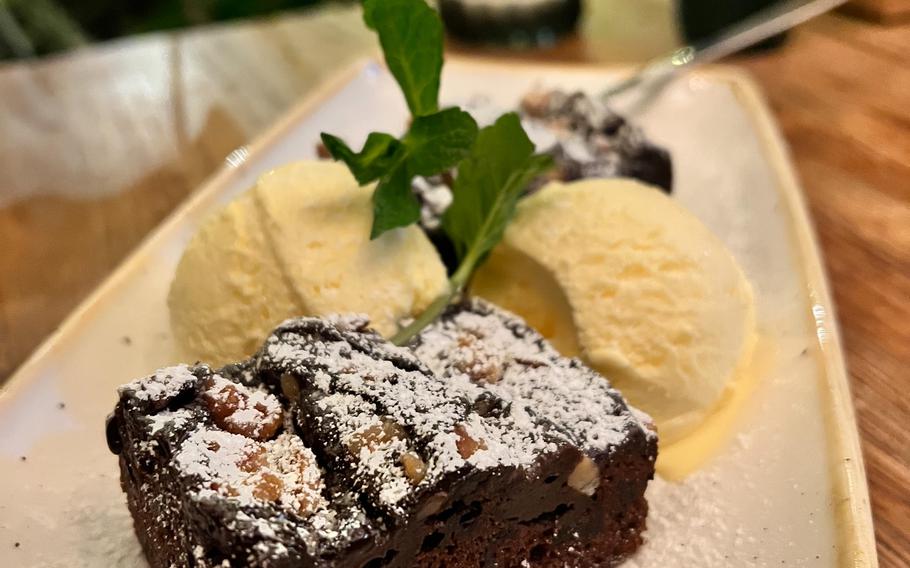 A warm brownie is served with vanilla ice cream at El Burro in Mainz, Germany, Nov. 20, 2022. The Mexican restaurant's dessert menu also includes churros, chimichanga dulce and cakes.