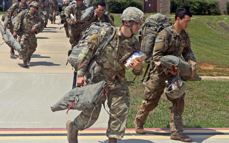 Paratroopers with the 82nd Airborne Division prepare to board an Air Force C-17 Globemaster III aircraft for an exercise at Fort Bragg, N.C., in June 2018. The Pentagon said Jan. 24, 2022, that roughly 8,500 troops based in the U.S. are ready to mobilize on short notice, should NATO activate its quick reaction force. 