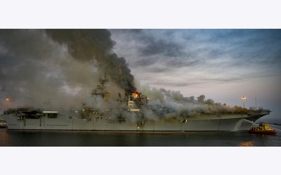 A fire continues to burn aboard the USS Bonhomme Richard (LHD 6) at Naval Base San Diego, on July 12, 2020. 