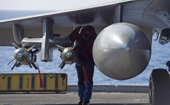 A sailor checks ordnance on the wing of a Rafale M  fighter-bomber prior to flight operations onboard the French aircraft carrier Charles de Gaulle in the eastern Mediterranean on Nov. 25, 2016.  The carrier is operating in support of the coalition fighting the Islamic State group in Iraq and Syria.  

Chris Church/Stars and Stripes


https://www.stripes.com/migration/anti-islamic-state-coalition-losing-french-flattop-1.441857
