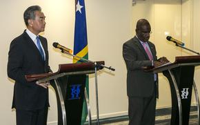 China's Foreign Minister Wang Yi, left, and his counterpart from the Solomon Islands, Jeremiah Manele hold a joint news conference in Honiara, Solomon Islands, early Thursday, May 26, 2022. Wang and a 20-strong delegation have arrived in the Solomon Islands at the start of an eight-nation Pacific tour that comes amid growing concerns about Beijing's military and financial ambitions in the region. (AP Photo)