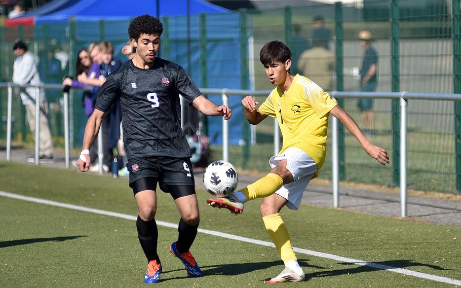 Vicenza shopmore Luis Roa boots the ball ahead of Bahrain winger Zeyad Ramadan during the first day of pool-play action of the 2025 Division II DODEA European championships at the stadium of VfB Reichenbach on May 19, 2025, in Reichenbach-Steegen, Germany.