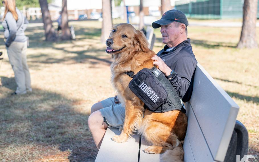 Vietnam War veteran David Wood sits with his K9s for Warriors service dog, Loose. Wood on Nov. 18, 2021, became the first Vietnam veteran to graduate from the Ponte Vedra Beach, Fla.-based nonprofit.
