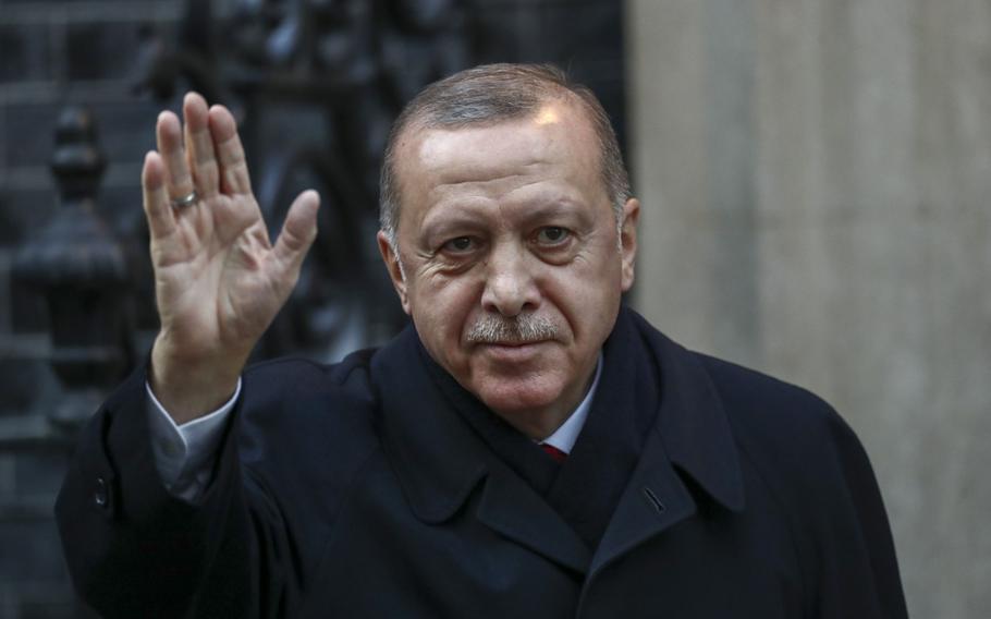 Recep Tayyip Erdogan, Turkey's president, gestures as he arrives for a multilateral meeting on the sidelines of the NATO summit in London, on Dec. 3, 2019. 