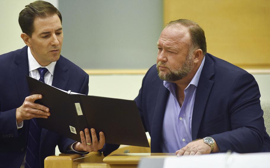 Plaintiff’s attorney Chris Mattei, left, questions Infowars founder Alex Jones during his defamation trial at Connecticut Superior Court in Waterbury, Conn., on Thursday, Sept. 22, 2022.