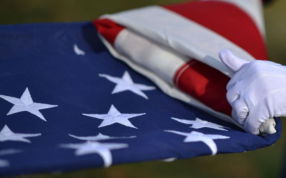 Airmen from the 106th Rescue Wing's Honor Guard perform Taps and a flag folding ceremony at the funeral for retired Master Sgt. Timothy David Ryanat St. John's Cemetery in Queens, New York on December 16, 2016.