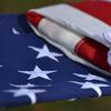 Airmen from the 106th Rescue Wing's Honor Guard perform "Taps" and a flag folding ceremony at the funeral for retired Master Sgt. Timothy David Ryanat St. John's Cemetery in Queens, New York on December 16, 2016. In addition to other ceremonial duties, members of the 106th Honor Guard are often called upon to provide full military honors for veteran's funerals. 