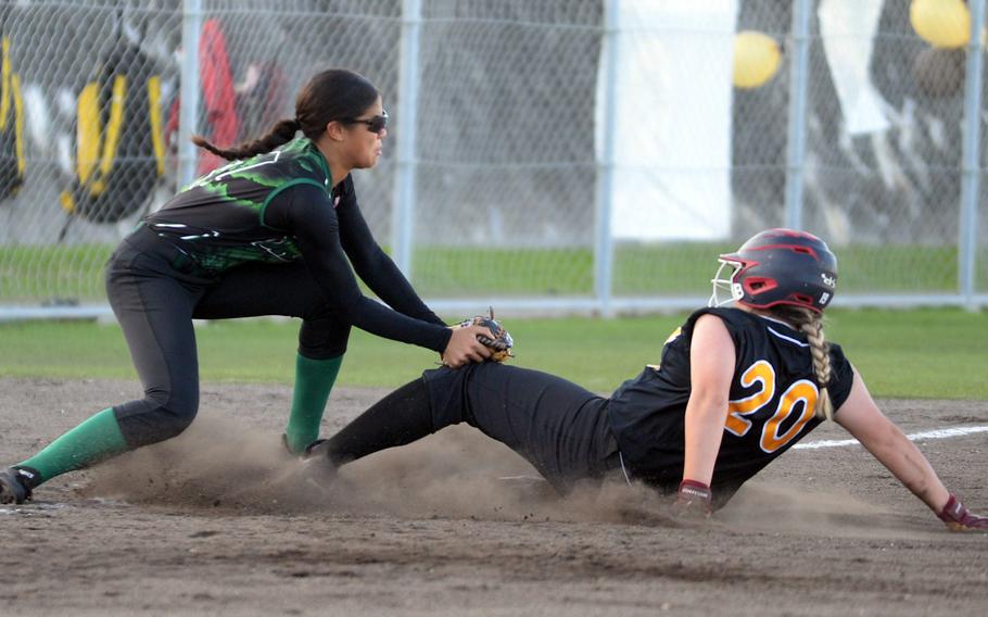 Ashlynne Leidig slides safely into third before getting tagged.