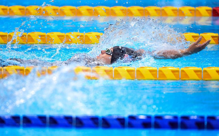 Army Sgt. 1st Class Elizabeth Marks swims backstroke on her way to a gold medal at Tokyo Aquatics Center on Friday, Sept. 3, 2021. 