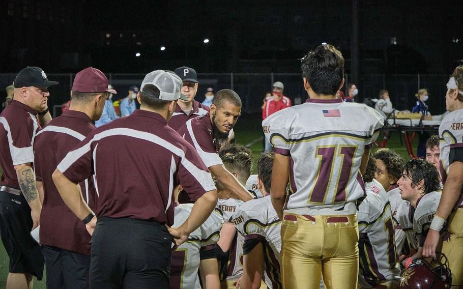 Matthew C. Perry coaches talk to players after a game against Nile C. Kinnick on Friday, Sept. 17, 2021.