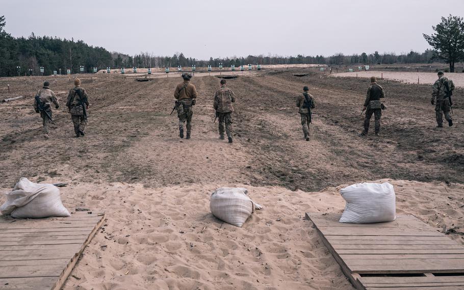 New recruits attend shooting practice at an Azov Brigade training camp outside Kyiv, Ukraine, on March 24, 2023. 