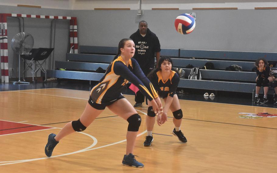 Ansbach's Kennedy Lange bumps the ball to set up the Cougars' offense Saturday, Oct. 15, 2022, as Ansbach split two matches with the Aviano Saints.