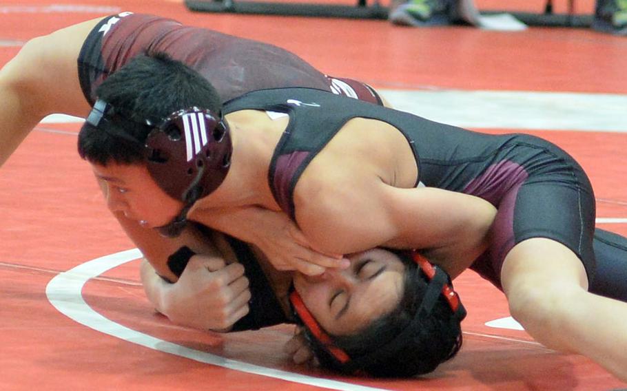 Matthew C. Perry's Gregory Campbell finishes off E.J. King's Alyssa Garcia in 1 minute, 4 seconds. Campbell went on to win at 108 pounds.
