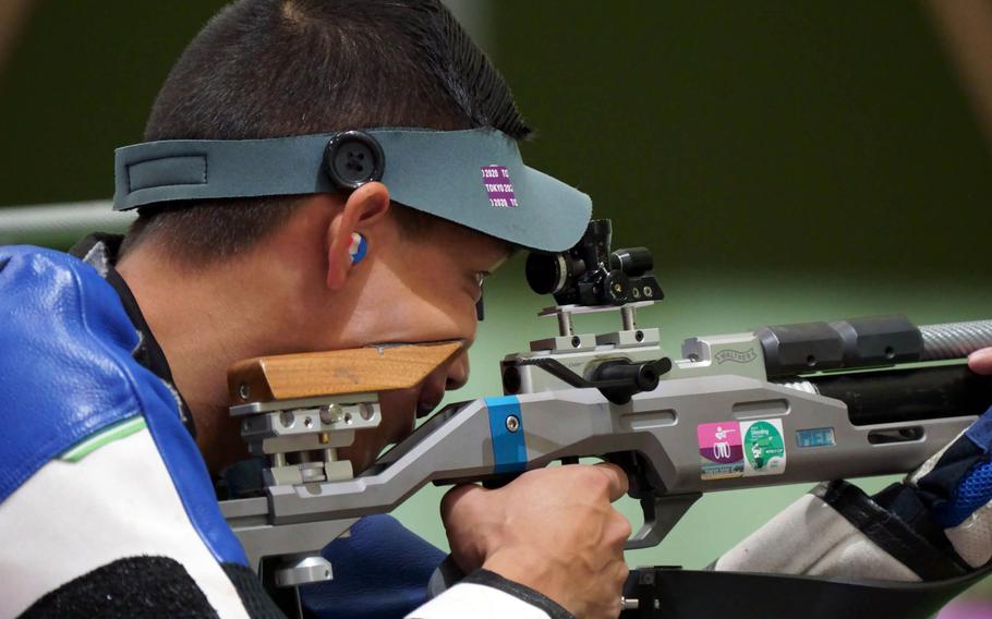 U.S. Army Staff Sgt. Kevin Nguyen prepares to fire during a Tokyo Paralympics shooting event at Camp Asaka, Japan, Wednesday, Sept. 1, 2021.