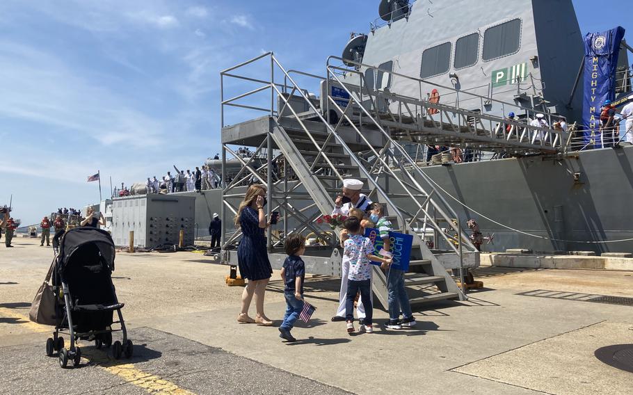 Petty Officer 3rd Class Jose Corral Salomon greets his family at USS Mahan's homecoming on Friday, Aug. 6, 2021.