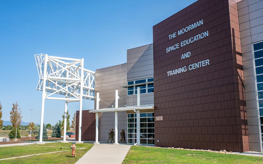 Airmen and guardians assigned to the 319th Combat Training Squadron enter the Moorman Space Education and Training Center at Peterson Space Force Base, Colo., in 2020.