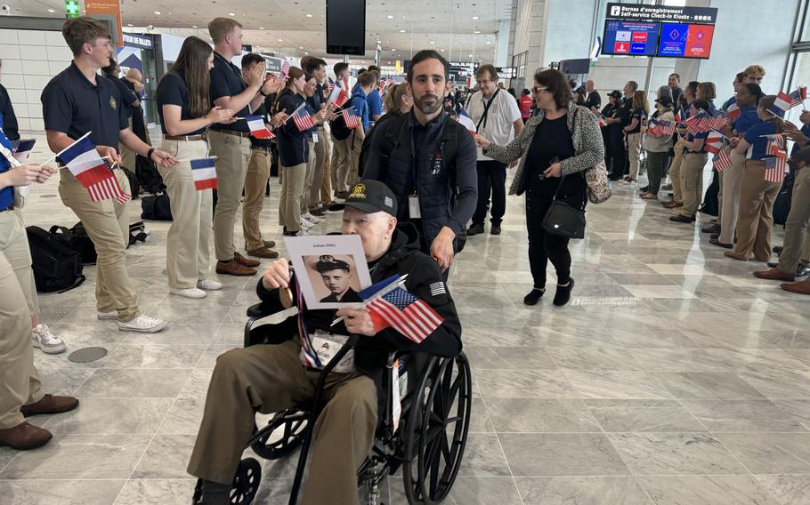 Veteran Julian Hilts is greeted by well wishers in Paris.
