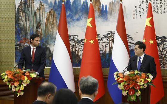 Dutch Deputy Prime Minister and Foreign Minister Wopke Hoekstra, left, and his Chinese counterpart Qin Gang hold a joint news conference following their meeting in Beijing, China, Tuesday May 23, 2023. (Thomas Peter/Pool Photo via AP)