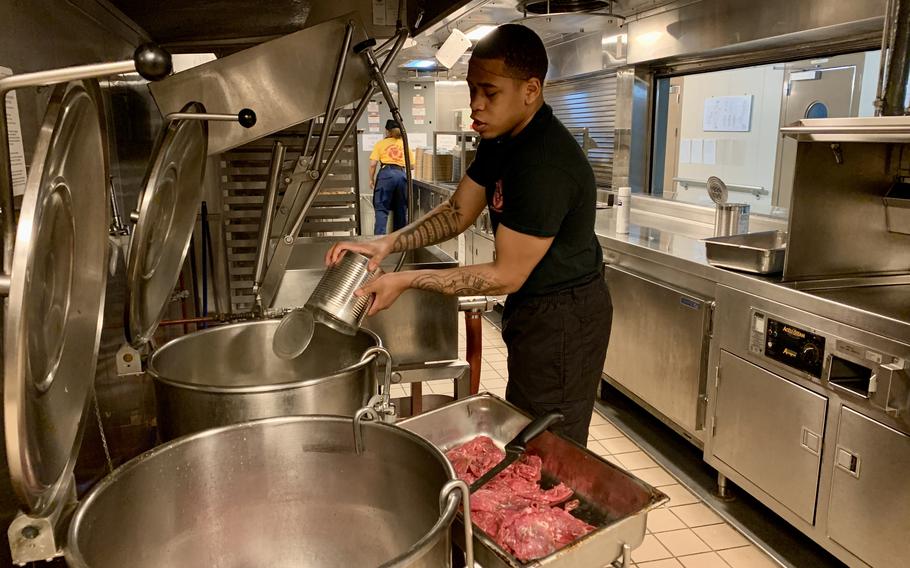 A sailor aboard USS Hershel "Woody" Williams prepares lunch for a crew of about 100 Navy sailors in the Gulf of Guinea on May 3, 2024. 