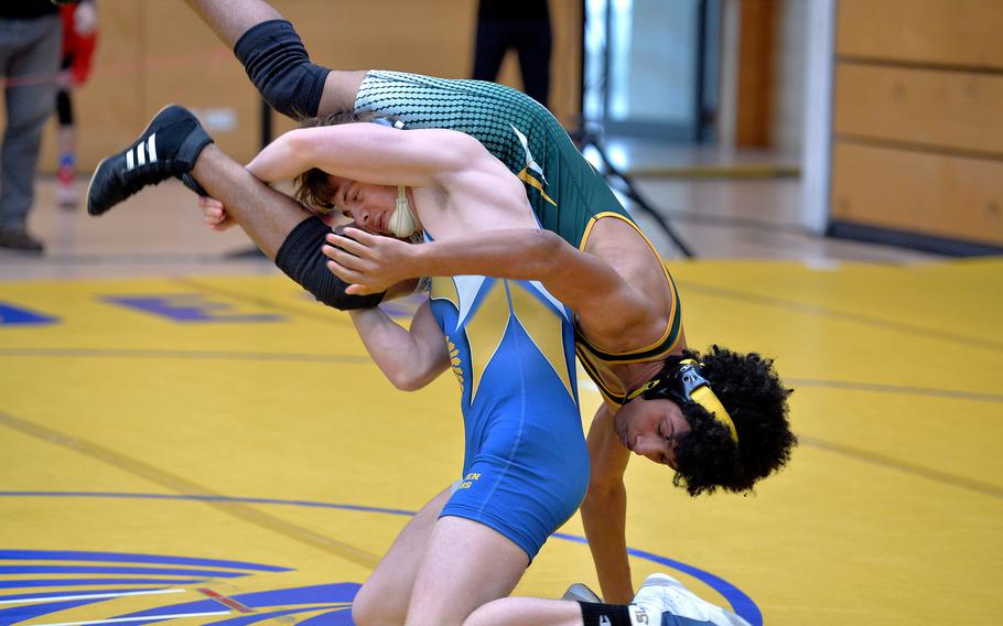 Wiesbaden’s Jacob Lane, left, defeated Donovan Traylor of SHAPE in a 144-pound match on opening day of the DODEA-Europe wrestling finals in Wiesbaden, Germany, Feb. 10, 2023.