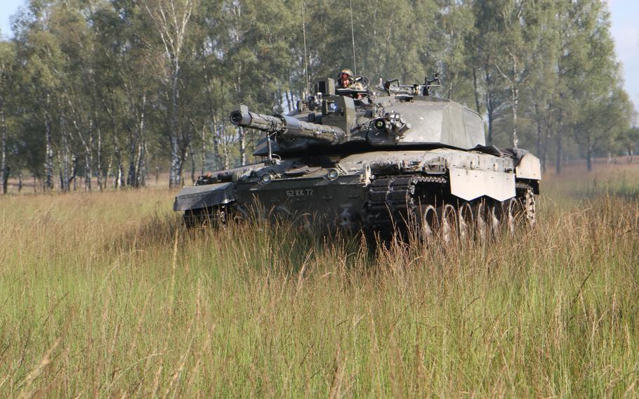 A British tank rumbles across Sennelager Training Area in northern Germany. The British army is establishing an equipment hub in Sennelager where tanks and other fighting vehicles will be placed.
