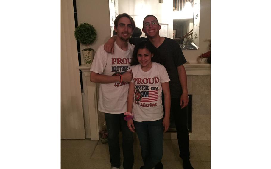 Lance Cpl. Dylan Merola with his brother Branden Murrell and sister Olivia Hernandez shortly after he graduated from Marine Corps boot camp.