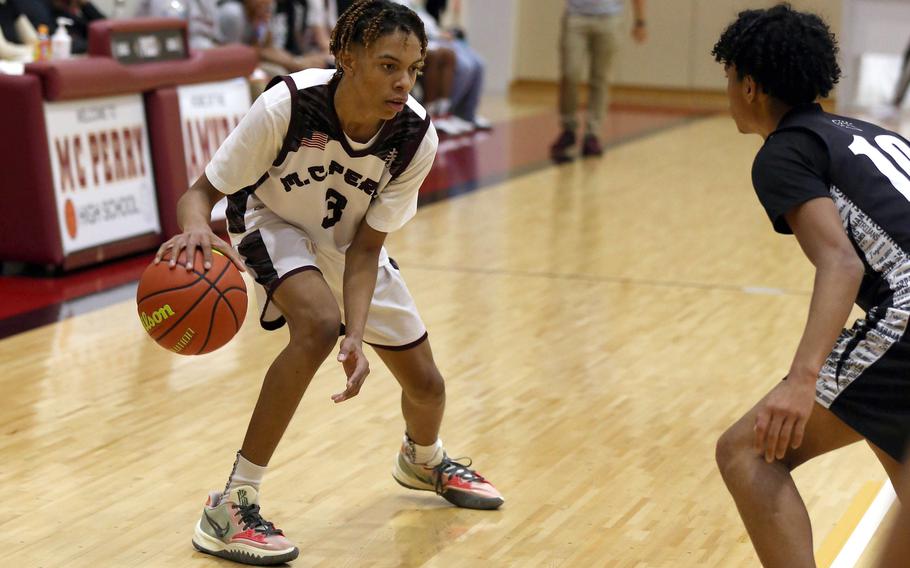 Matthew C. Perry's Billy Hill looks to drive against Zama's Chris Jones during Friday's DODEA-Japan boys basketball game. The Samurai won 58-44.