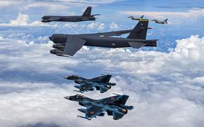 U.S., Japanese and South Korean jets flying in formation.